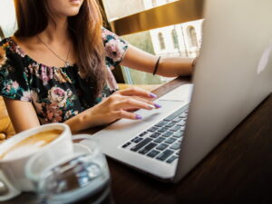 Adult woman working on a computer online