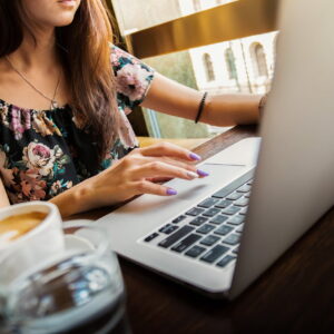 Adult woman working on a computer online